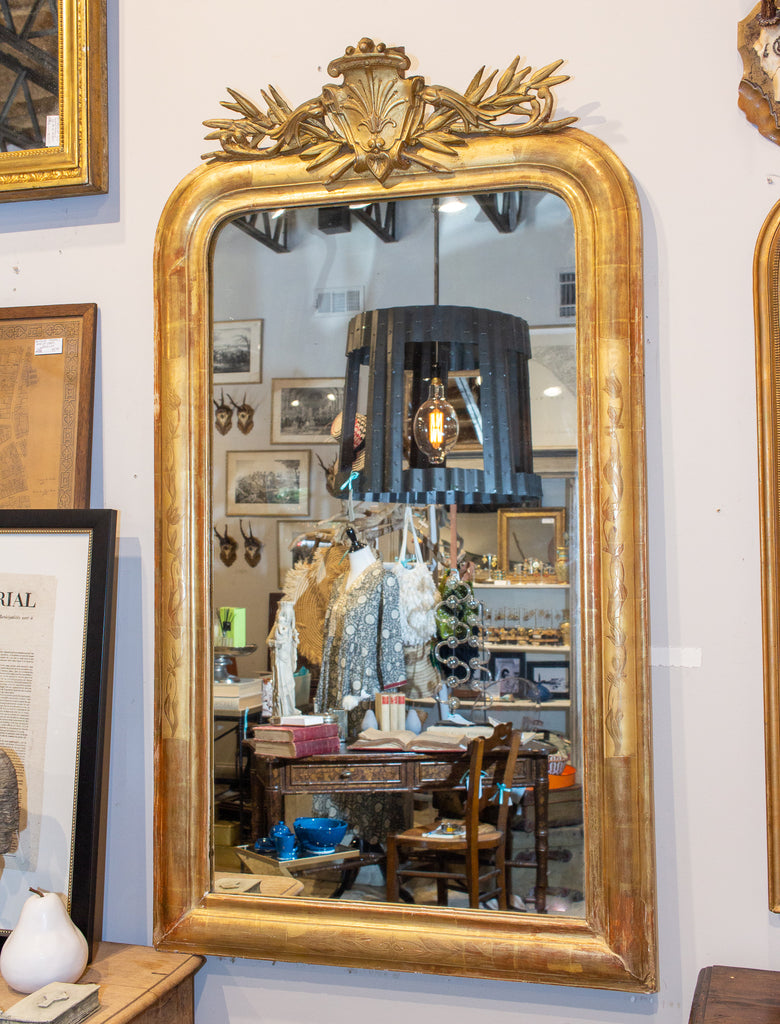 Our ornate gold mirror with white calligraphy on gold easel with a floral  garland, in the tre…